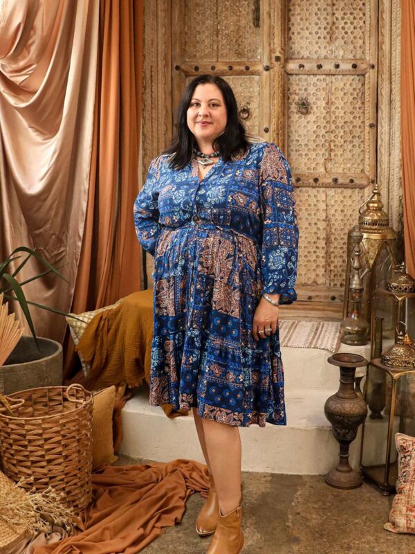 indigo blue dress with long sleeves and cream coloured paisley pattern