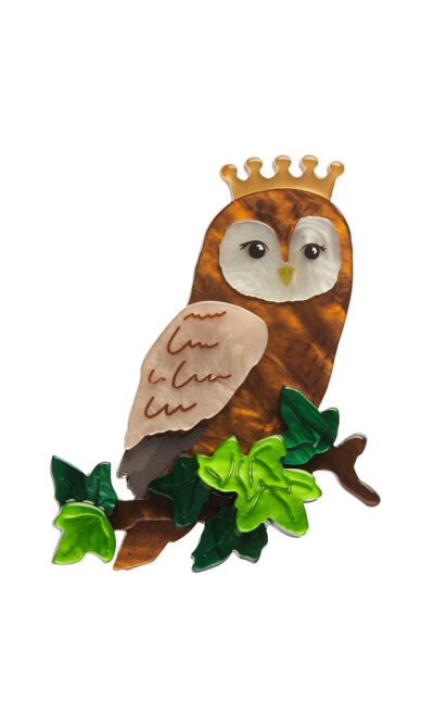 Women's brooch depicting a regal owl perched on a branch wearing a crown.