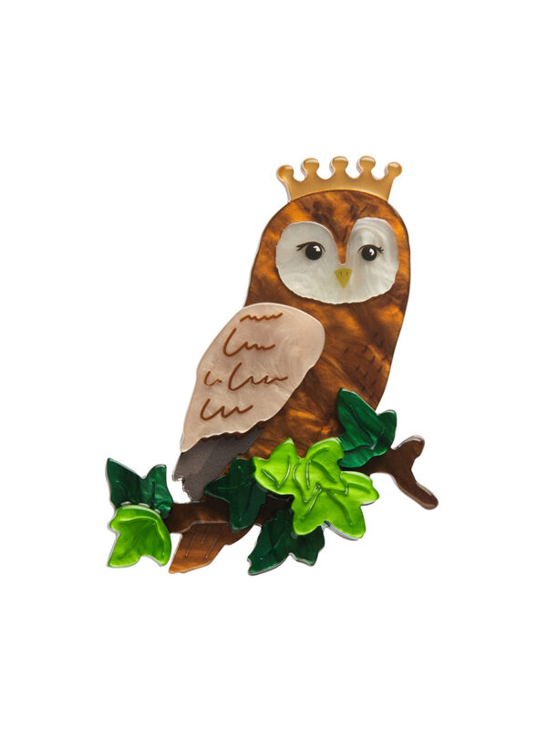 Women's brooch depicting a regal owl perched on a branch wearing a crown.