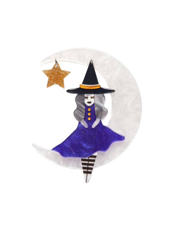 A woman's brooch depicts a witch sitting on a crescent moon with a star.