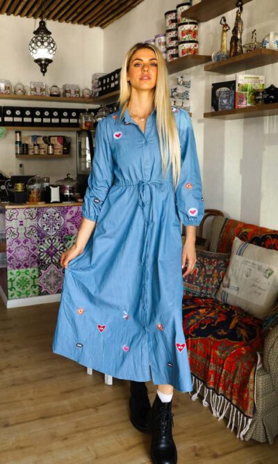 woman wearing a blue denim maxi dress