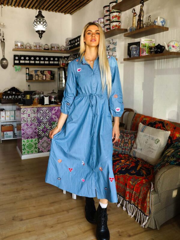 woman wearing a blue denim maxi dress