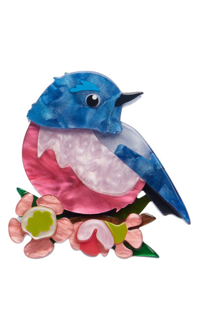 A woman's brooch depicts a Robin on a branch.