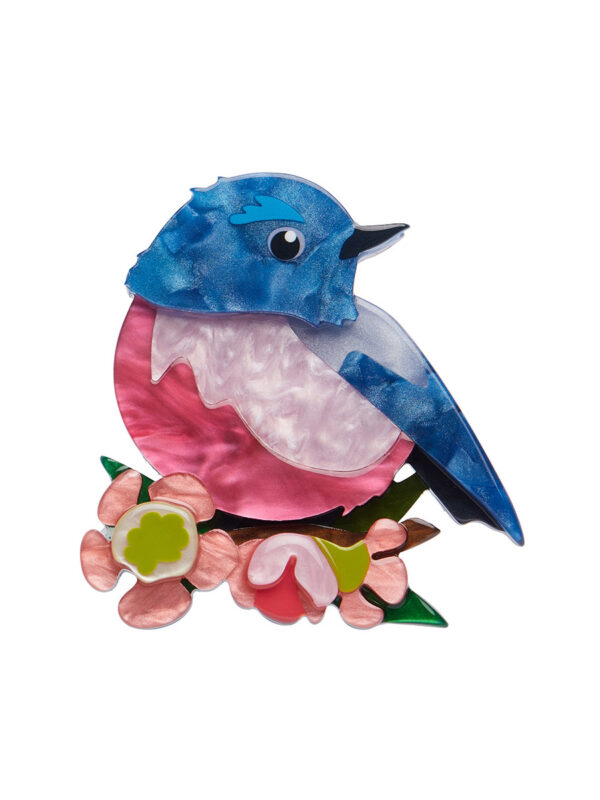 A woman's brooch depicts a Robin on a branch.