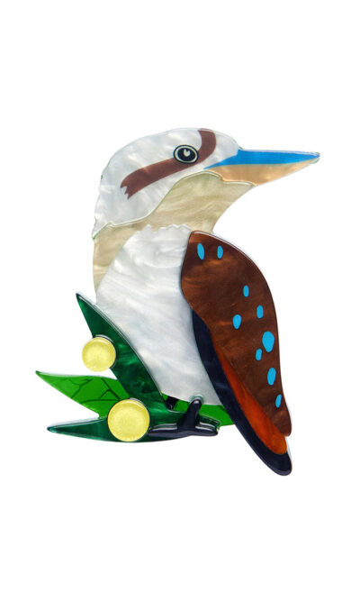 A woman's brooch depicts a kookaburra on a branch.