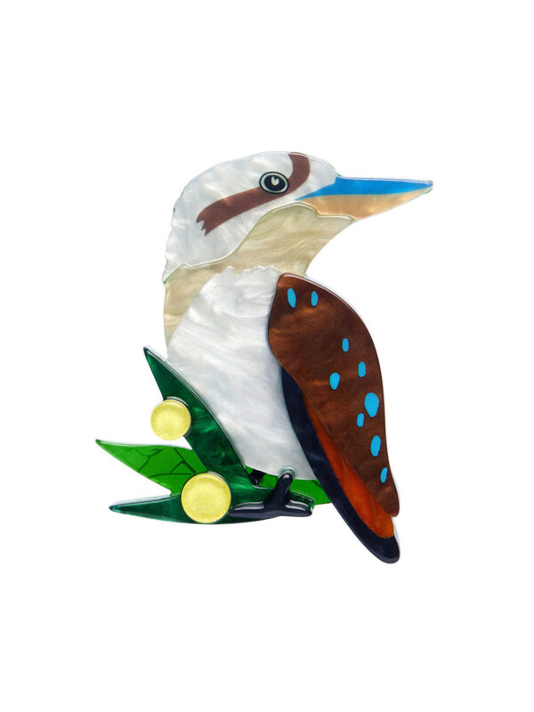 A woman's brooch depicts a kookaburra on a branch.